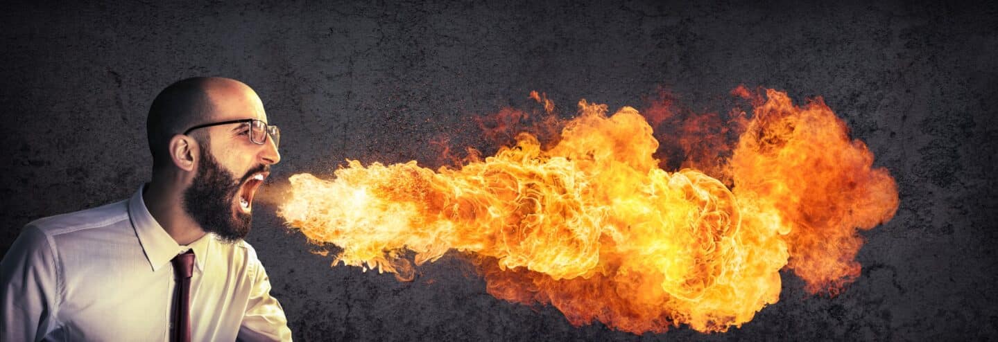man breathing fire