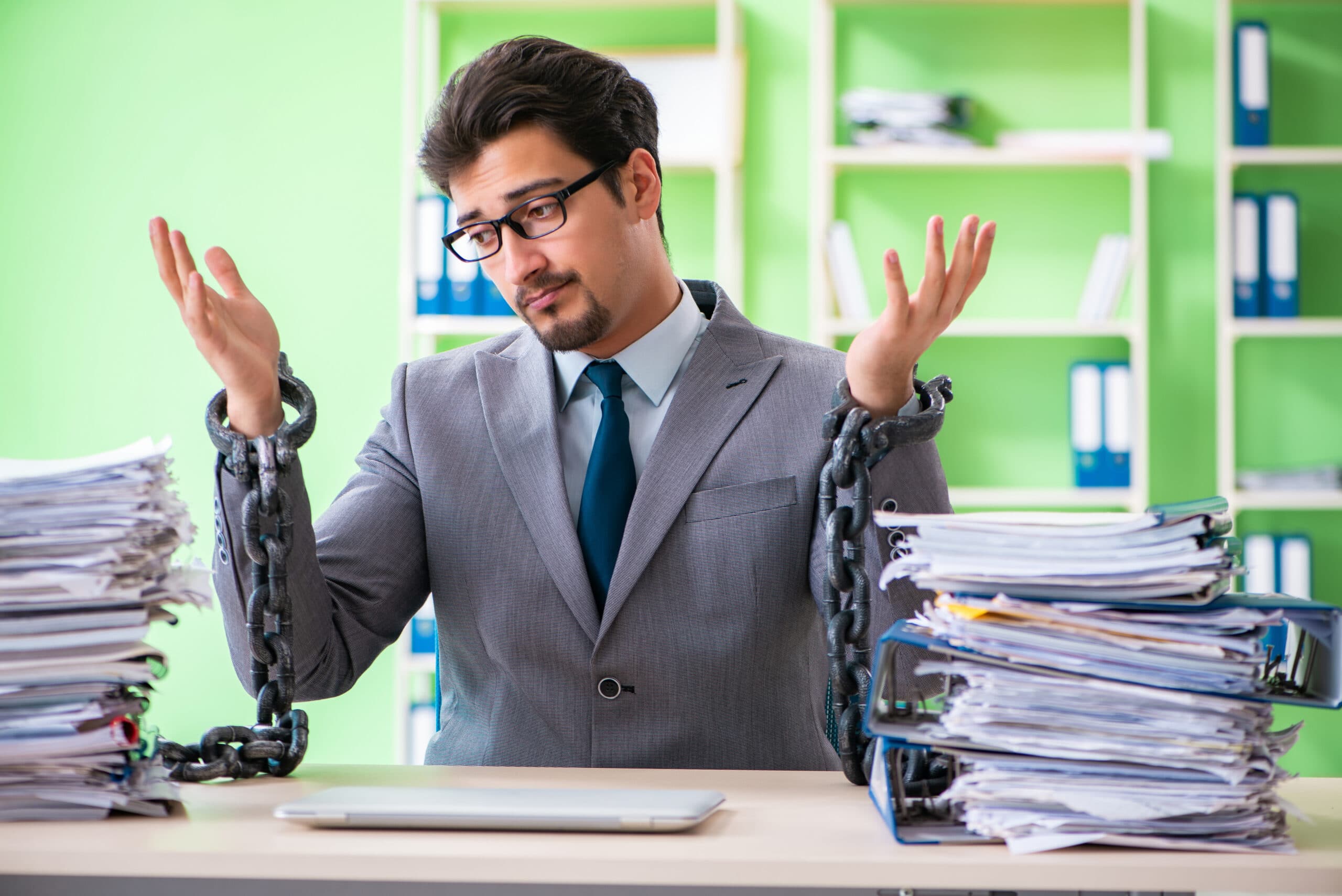 Man locked to a desk