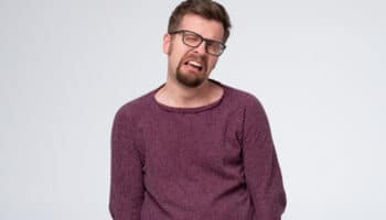 Mature caucasian man in glasses crying having troubles