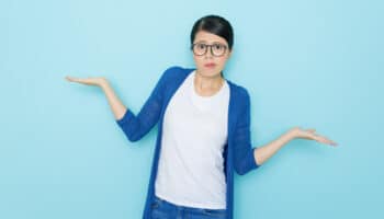 unhappy young woman showing choosing posing