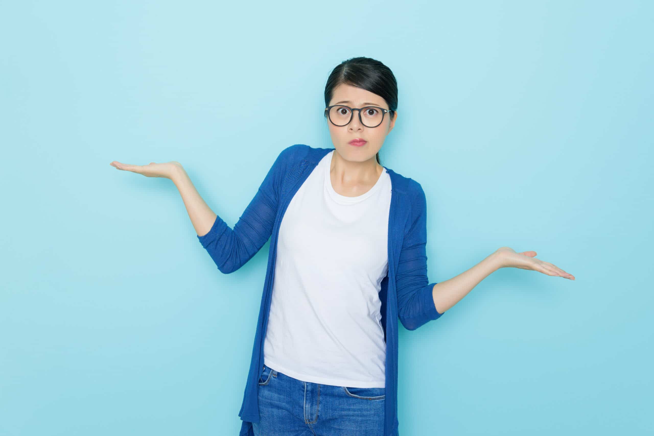 unhappy young woman showing choosing posing