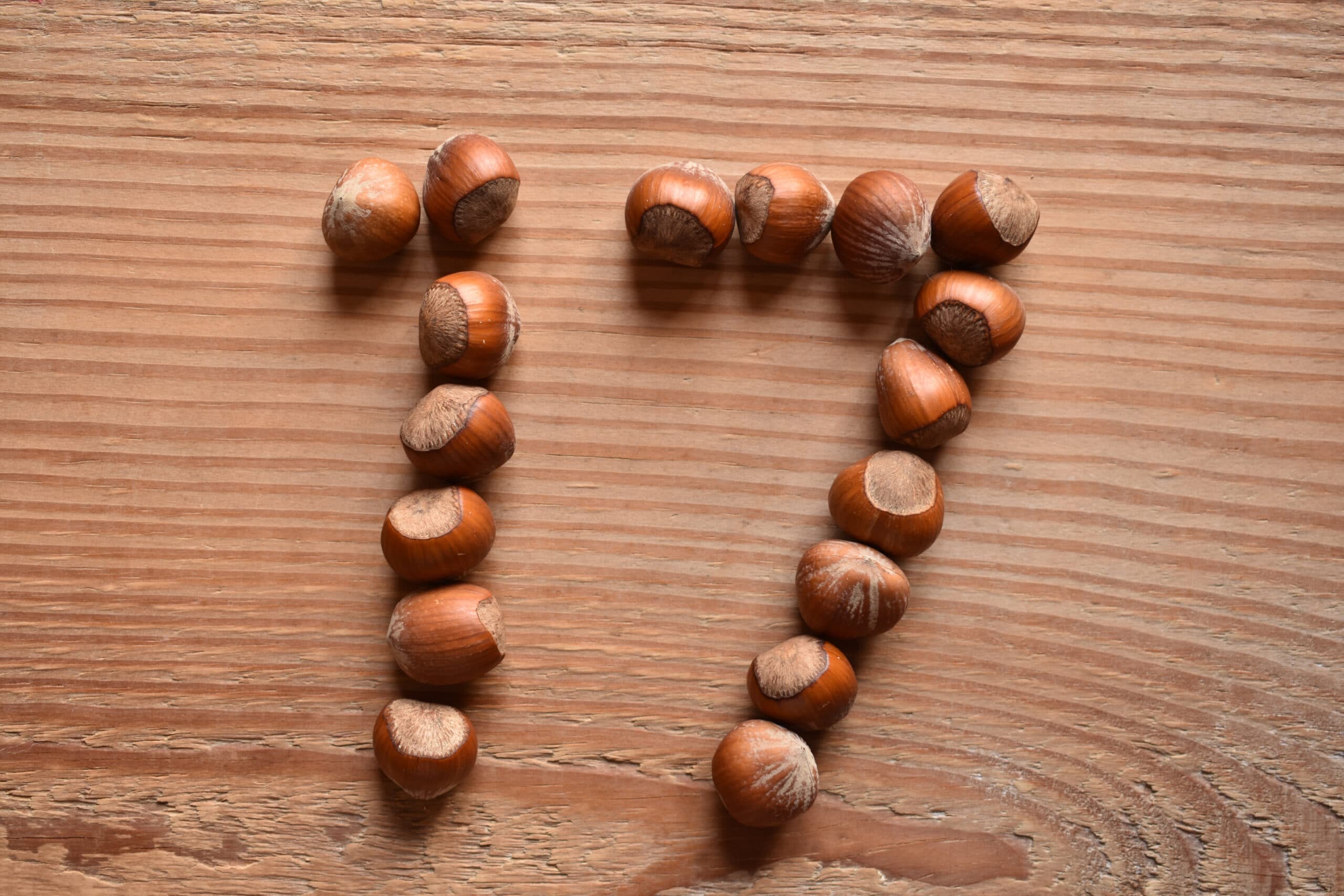 the number 17 shaped with hazelnuts