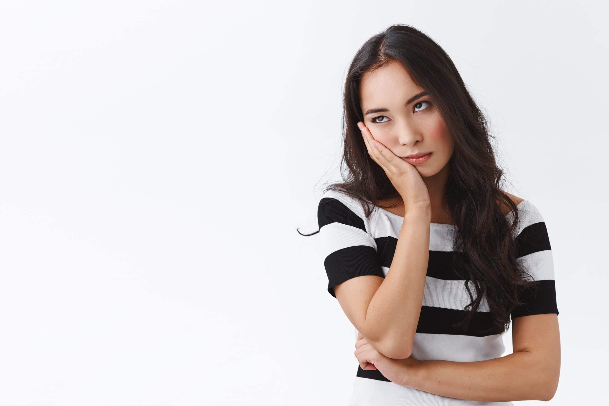 Girl cant stand long talks, wanna escape from boring meeting. Annoyed and bored fed up asian female, facepalm and roll eyes bothered, standing uninterested and dissatisfied over white background